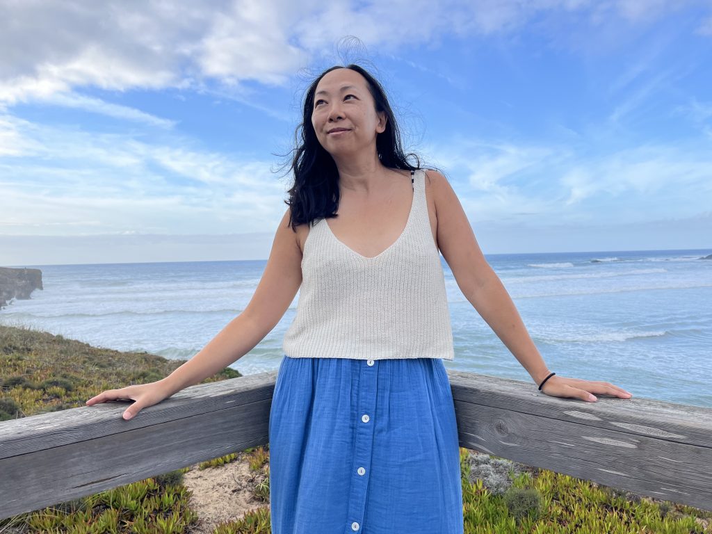 grief-coach-Charlene-Lam-blue-sky-Aljezur-Portugal-smile-happy-after-loss-IMG_1305